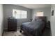 Bedroom featuring a queen bed, rug, and dresser at 5100 Bullard St, North Port, FL 34287