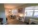 Bright dining area with a table set, white console and lots of natural light from the adjacent windows at 5100 Bullard St, North Port, FL 34287