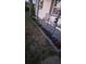 Charming exterior entrance with flower beds and seating area, perfect for enjoying the outdoors at 5100 Bullard St, North Port, FL 34287
