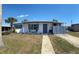 Cozy single-story home featuring well-maintained landscaping and charming curb appeal at 5100 Bullard St, North Port, FL 34287