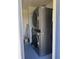 Modern stacked washer and dryer with dark finish in a small closet at 5100 Bullard St, North Port, FL 34287