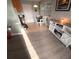 Cozy dining area with tile floor, white table and chairs, and a modern media center at 5100 Bullard St, North Port, FL 34287