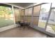 Enclosed patio with tile flooring and outdoor seating, ideal for relaxation at 5100 Bullard St, North Port, FL 34287