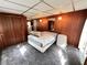 Spacious bedroom with paneled walls, cozy carpeting, and bright natural light at 6830 Pleasant Ct, North Port, FL 34287