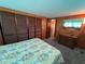 Spacious bedroom featuring closet space, vintage dresser, and soft natural lighting at 6830 Pleasant Ct, North Port, FL 34287