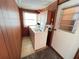 Functional laundry room with a washer, dryer, built-in cabinets, and exterior access at 6830 Pleasant Ct, North Port, FL 34287