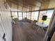 Bright sunroom filled with natural light, comfortable seating, and an outdoor view at 6830 Pleasant Ct, North Port, FL 34287