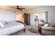Bedroom featuring a ceiling fan, balcony access, closet and light wood flooring at 93 Vivante Blvd # 9323, Punta Gorda, FL 33950