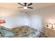 Well-lit bedroom featuring two closets, a ceiling fan, and a side table with a lamp at 93 Vivante Blvd # 9323, Punta Gorda, FL 33950
