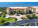 Beautiful condo building featuring lush landscaping and water views at 93 Vivante Blvd # 9323, Punta Gorda, FL 33950