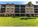 Attractive multi-story condominium complex with lush landscaping and convenient ground-level parking at 93 Vivante Blvd # 9323, Punta Gorda, FL 33950