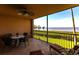 Relaxing lanai providing stunning water views, furnished with comfortable seating and a ceiling fan at 93 Vivante Blvd # 9323, Punta Gorda, FL 33950