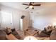Inviting living room with neutral walls, dark brown furniture, and light wood flooring at 93 Vivante Blvd # 9323, Punta Gorda, FL 33950