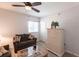 Bright living room featuring a ceiling fan, light colored cabinet, and comfortable sofa at 93 Vivante Blvd # 9323, Punta Gorda, FL 33950