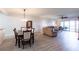 Open concept living room with hardwood flooring and access to a private balcony with great views at 93 Vivante Blvd # 9323, Punta Gorda, FL 33950