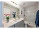 Modern bathroom featuring a walk-in shower with marble accents, and vanity with a large mirror and ample counter space at 11401 2Nd Ave, Punta Gorda, FL 33955