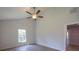 Bright bedroom with hardwood floors, ceiling fan, and natural light at 11401 2Nd Ave, Punta Gorda, FL 33955