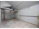 Empty one car garage with garage door and concrete floor at 11401 2Nd Ave, Punta Gorda, FL 33955