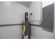 A utility room shows an electric panel and water heater at 11401 2Nd Ave, Punta Gorda, FL 33955