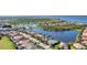 Community aerial showcasing lush landscaping, lakes, and picturesque homes at 13056 N Marsh Dr, Port Charlotte, FL 33953
