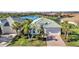 Aerial view of home with a well-manicured lawn and water view at 13056 N Marsh Dr, Port Charlotte, FL 33953