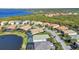 Beautiful aerial view of a single Gathering home community near a lake and waterfront at 13056 N Marsh Dr, Port Charlotte, FL 33953