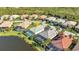 Aerial view of properties with screened pools and meticulous landscaping at 13056 N Marsh Dr, Port Charlotte, FL 33953
