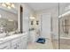 Bathroom features large walk-in shower, double sinks, and seamless glass at 13056 N Marsh Dr, Port Charlotte, FL 33953