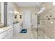 Bathroom features large walk-in shower, double sinks, and seamless glass at 13056 N Marsh Dr, Port Charlotte, FL 33953