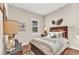 Inviting bedroom with wood furniture and tropical-themed wall decor at 13056 N Marsh Dr, Port Charlotte, FL 33953