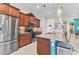 Modern kitchen with stainless steel appliances, granite countertops, and ample cabinet space at 13056 N Marsh Dr, Port Charlotte, FL 33953