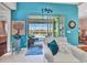 Charming living room featuring a sliding glass door that opens to a screened-in lanai and inviting pool at 13056 N Marsh Dr, Port Charlotte, FL 33953