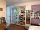 Bedroom featuring mirrored closet doors, hardwood floors, and neutral wall colors at 137 Revere Nw St, Port Charlotte, FL 33952