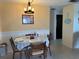 Cozy dining area with a chandelier and a view of the hallway at 137 Revere Nw St, Port Charlotte, FL 33952