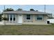 Charming single-story home with well-maintained lawn and a cozy, inviting entrance at 137 Revere Nw St, Port Charlotte, FL 33952