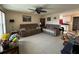 Spacious living room featuring tile floors, comfortable seating, and bright, natural light at 137 Revere Nw St, Port Charlotte, FL 33952