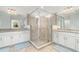 Bathroom with a tile enclosed shower, dual sinks, and granite countertops at 14049 Black Beauty Dr # 721, Punta Gorda, FL 33955