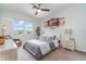 Comfortable bedroom with a ceiling fan, a serene color scheme, and lots of natural light at 14049 Black Beauty Dr # 721, Punta Gorda, FL 33955