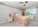 Cozy bedroom featuring a ceiling fan, a comfortable bed, and a serene color scheme at 14049 Black Beauty Dr # 721, Punta Gorda, FL 33955