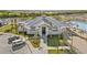 Attractive clubhouse exterior, featuring a modern design, landscaping, and ample parking at 14049 Black Beauty Dr # 721, Punta Gorda, FL 33955