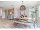 Elegant dining area with modern light fixture, stylish decor, and tile flooring at 14049 Black Beauty Dr # 721, Punta Gorda, FL 33955