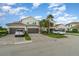 Inviting townhome with two-car garages, paver driveway, and mature landscaping at 14049 Black Beauty Dr # 721, Punta Gorda, FL 33955