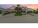 Charming two-story townhouse with attached garages and well-manicured landscaping at sunset at 14049 Black Beauty Dr # 721, Punta Gorda, FL 33955