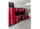 Garage featuring a set of tool cabinets with a black countertop, with a light gray floor and gray accents at 14049 Black Beauty Dr # 721, Punta Gorda, FL 33955