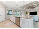 Kitchen island featuring stainless steel appliances, granite countertops, and an open floorplan at 14049 Black Beauty Dr # 721, Punta Gorda, FL 33955