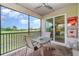 Relaxing screened lanai with a table, chairs, and scenic views of the golf course at 14049 Black Beauty Dr # 721, Punta Gorda, FL 33955