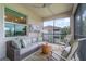 Cozy screened lanai with comfortable seating, perfect for relaxing and enjoying the outdoors at 14049 Black Beauty Dr # 721, Punta Gorda, FL 33955
