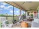 Spacious screened lanai with ample seating, views of the lush landscaping, and golf course beyond at 14049 Black Beauty Dr # 721, Punta Gorda, FL 33955