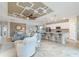 Open-concept living space with tile floors, stylish seating, granite counters and modern kitchen at 14049 Black Beauty Dr # 721, Punta Gorda, FL 33955