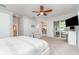 Spacious main bedroom with a ceiling fan, a seating area, and access to a private outdoor space at 14049 Black Beauty Dr # 721, Punta Gorda, FL 33955